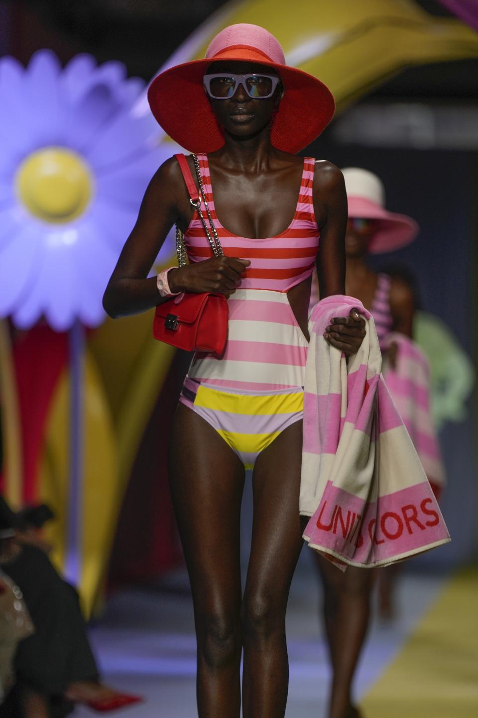 A model wears a creation as part of the Benetton women's Spring Summer 2024 collection presented in Milan, Italy, Thursday, Sept. 21, 2023. (AP Photo/Luca Bruno)