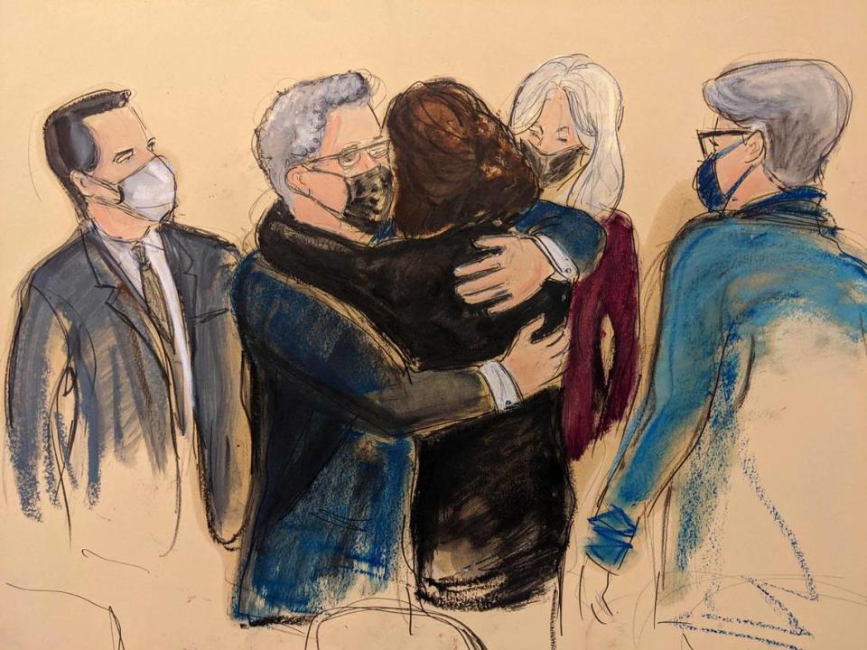 In this courtroom sketch, Ghislaine Maxwell, center, is hugged by attorney Jeffrey Pagliuca as Maxwell enters court for the voir dire portion of jury selection, Tuesday, Nov. 16, 2021, in New York.