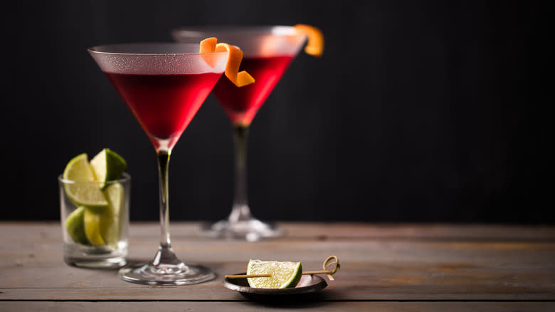 cosmopolitans and lime slices on a table