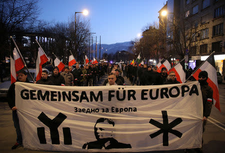 Members and supporters of several nationalist organizations take part in a march in commemoration of late General Hristo Lukov, a Bulgarian army commander, in Sofia, Bulgaria, February 16, 2019. The banner reads "Together for Europe". REUTERS/Stoyan Nenov