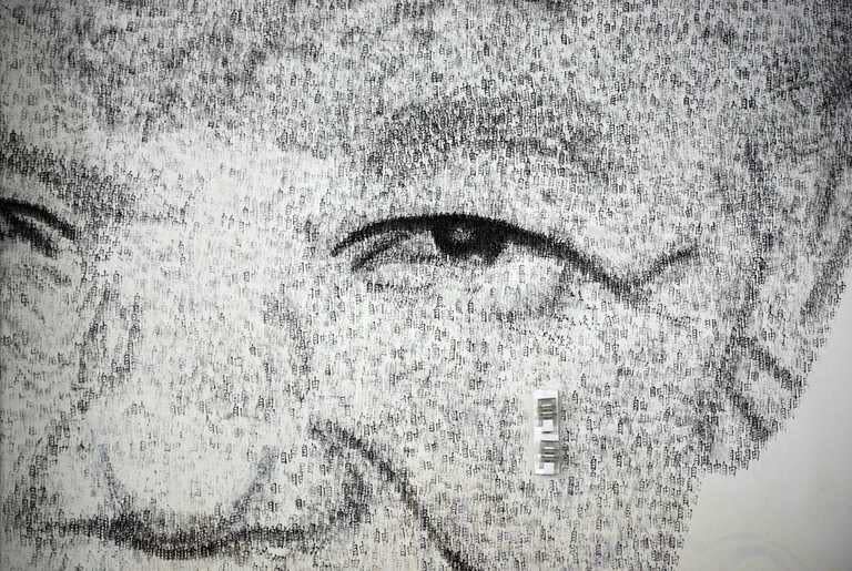 A close-up detail of Shanghai-based Belgian artist Phil Akashi's portrait of South African peace icon and former boxer Nelson Mandela, which he forged by pounding the wall 27,000 times with a boxing glove bearing Chinese character for "freedom", in Shanghai, on August 1, 2013