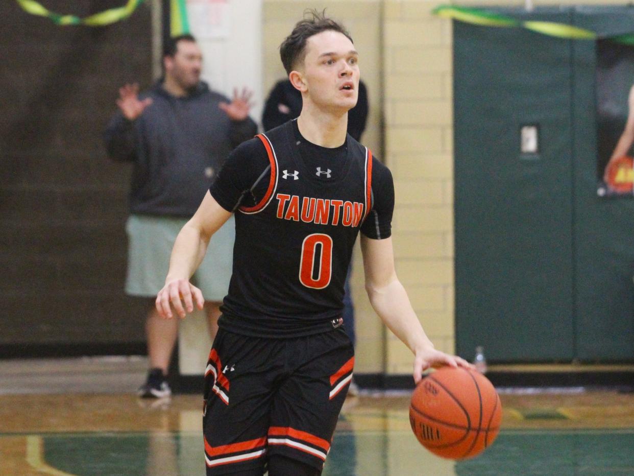 Taunton's Troy Santos dribbles up court during a Hockomock League game against King Philip.