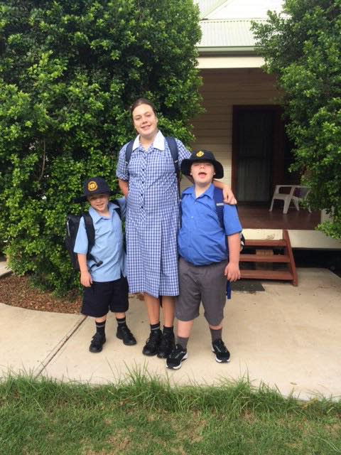 Three siblings with disabilities pictured outside their rural NSW home. They travel 700kms to The Shine Shed in Campbelltown.