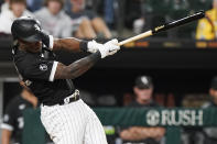 Chicago White Sox's Tim Anderson hits an RBI single during the eighth inning of the team's baseball game against the Cleveland Indians in Chicago, Friday, July 30, 2021. (AP Photo/Nam Y. Huh)