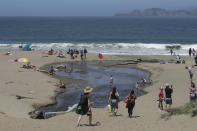 People visit Baker Beach during the coronavirus outbreak in San Francisco, Sunday, May 24, 2020. (AP Photo/Jeff Chiu)