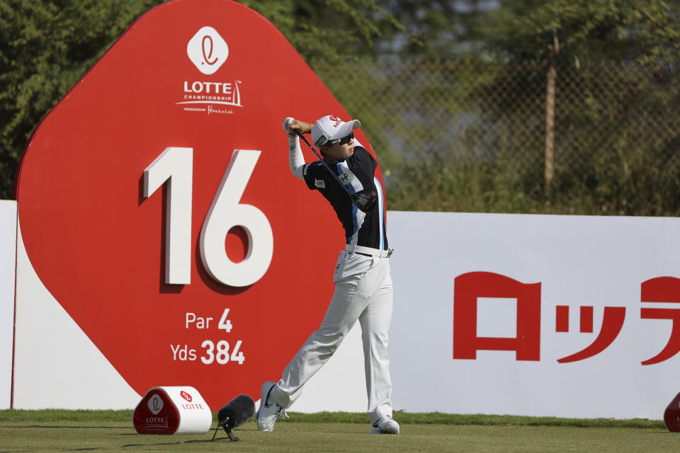 Hyo Joo Kim, of South Korea, watches her shot from the 16th tee during the first round of the LPGA golf tournament Wednesday, April 12, 2023, near Honolulu. (AP Photo/Marco Garcia)