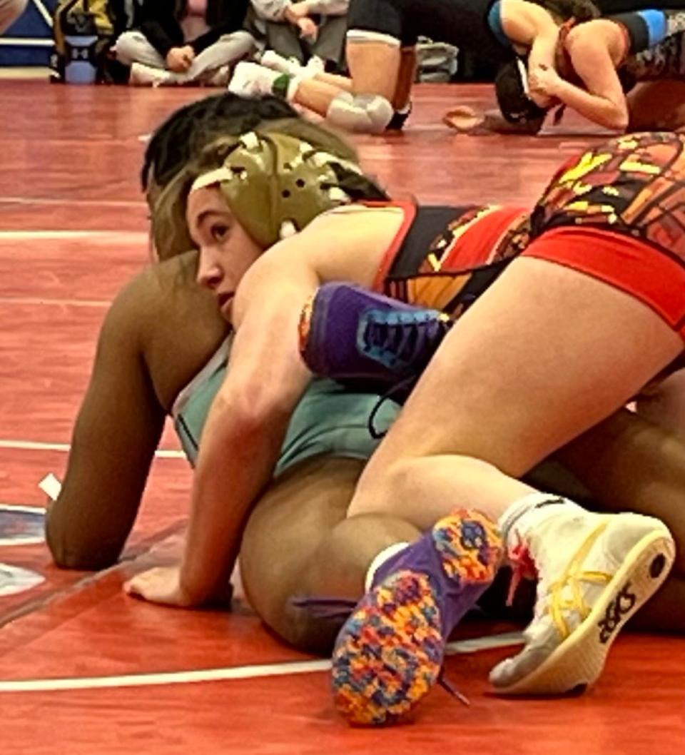 Ashland's Nora Quitt, top, wrestles against Jada Lawrence of South Carolina at the National High School Coaches Association wrestling tournament in Virginia Beach on April 7, 2024.