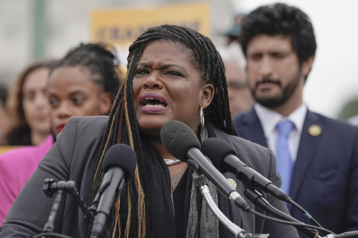 Representative Cori Bush speaks at a news conference.