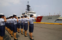 Philippine Coast Guard personnel salute to welcome the U.S. Coast Guard National Security Cutter Bertholf (WMSL 750) as it arrives for a port call in the first visit by a U.S. cutter in over seven years, Wednesday, May 15, 2019 in Manila, Philippines. Capt. John Driscoll, commanding officer of the Bertholf, told reporters that two Chinese Coast Guard ships were spotted off the South China Sea while they were conducting a joint exercise with Philippine Coast Guard. (AP Photo/Bullit Marquez)