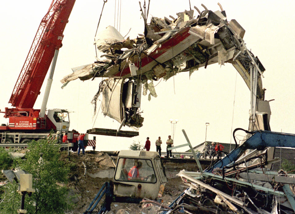 FILE - A crane lifts a coach of the derailed high-speed train from the track at the crash site in Eschede, on June 6, 1998. Rail travel in Europe is a common and relatively affordable and convenient way for many Europeans to travel. It also has a good safety record overall, growing safer in past years. Yet the tragedy in Greece on Wednesday is a reminder of how deadly crashes can be when they happen. (AP Photo/Jockel Finck, File)