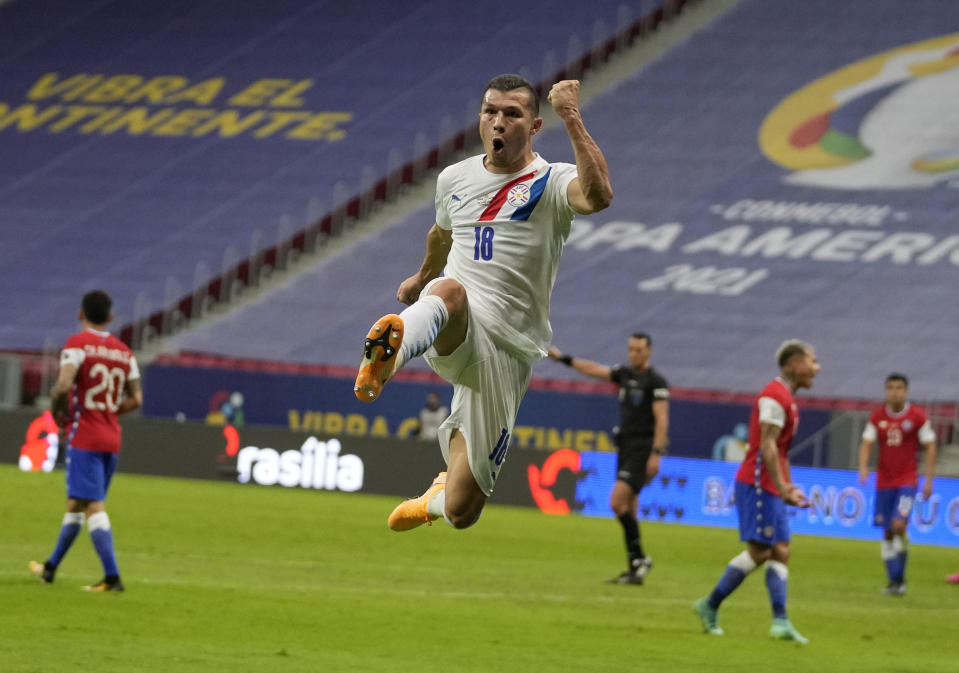 Paraguay's Braian Samudio celebrates scoring his side's opening goal against Chile during a Copa America soccer match at National stadium in Brasilia, Brazil, Thursday, June 24, 2021. (AP Photo/Ricardo Mazalan)