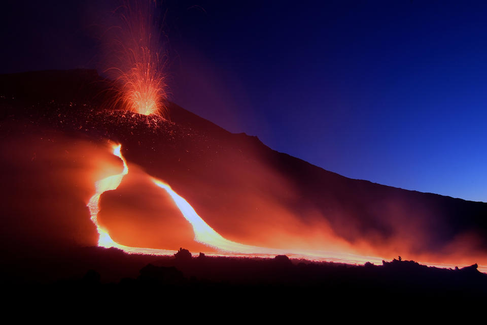 Mount Etna spews lava on the southern Italian island of Sicily, in the early hours of July 17, 2006. The volcano has been erupting since Saturday, local media reported. REUTERS/Antonio Parrinello (ITALY)