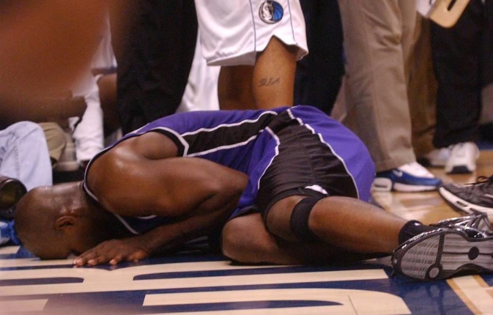 The Sacramento Kings’ Chris Webber lies on the floor in the third quarter of Game 2 of the Western Conference Semifinals between the Sacramento Kings and the Dallas Mavericks at the American Airlines Center in Dallas on May 8, 2003.