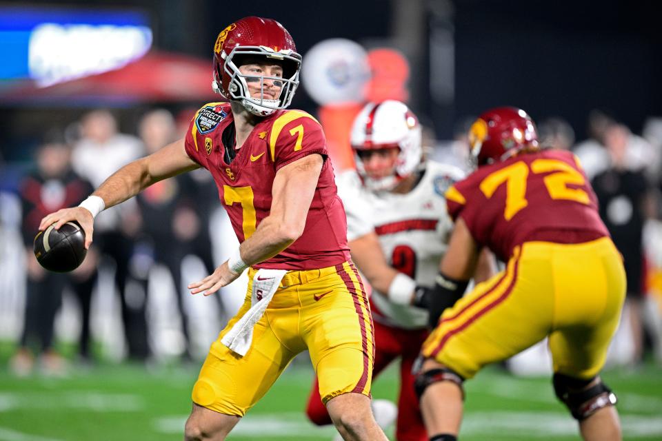 USC quarterback Miller Moss (7) throws a pass against Louisville during the Holiday Bowl.