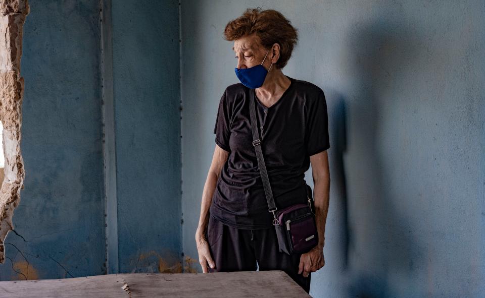 Makrouhi Arkanian in the destroyed remains of her home that one year on has still not been repaired (Bel Trew)