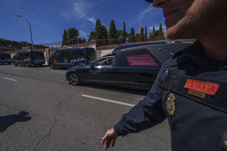 A hearse carrying the coffin with the remains of the Jose Antonio Primo de Rivera, founder of the Spanish fascist party, the Falange, drives to San Isidro Cemetery in Monday, April 24, 2023. The body of Jose Antonio Primo de Rivera, exhumed from a Madrid mausoleum on Monday, is being transferred to a city cemetery. (AP Photo/Manu Fernandez)