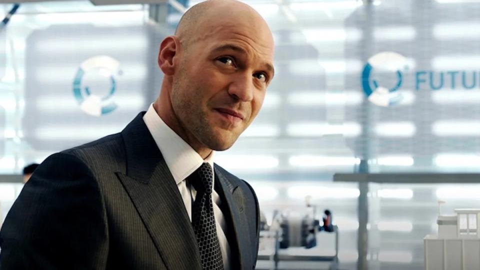 Corey Stoll as Darren Cross in a black suit and white shirt in Ant-Man