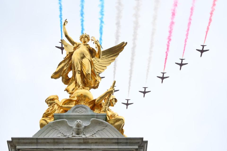 london, england may 06 the royal air force aerobatic team otherwise known as the red arrows fly over the queen victoria memorial during the coronation of king charles iii and queen camilla on may 06, 2023 in london, england the coronation of charles iii and his wife, camilla, as king and queen of the united kingdom of great britain and northern ireland, and the other commonwealth realms takes place at westminster abbey today charles acceded to the throne on 8 september 2022, upon the death of his mother, elizabeth ii photo by dan mullangetty images