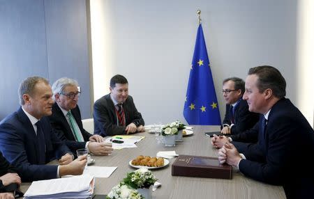 British Prime Minister David Cameron (R) attends a bilateral meeting with European Council President Donald Tusk (L) and European Commission President Jean-Claude Juncker (2nd L) during a European Union leaders summit addressing the talks about the so-called Brexit and the migrants crisis in Brussels, Belgium, February 19, 2016. REUTERS/Francois Lenoir