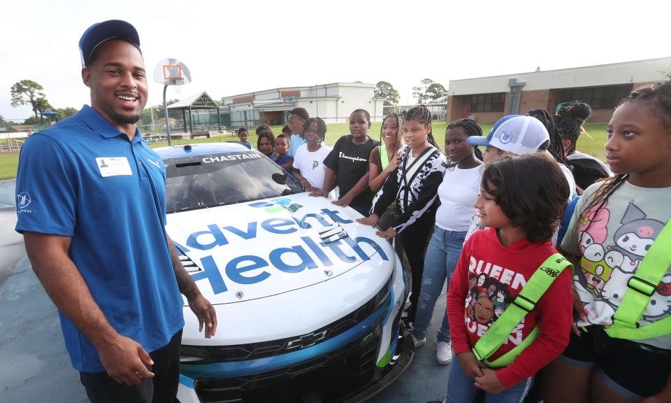 NASCAR pit crew member Journey Brown visits with students at a Daytona Beach, Fla., elementary school last August. He's in town for the NASCAR Cup Series race Sunday at Circuit of the Americas.