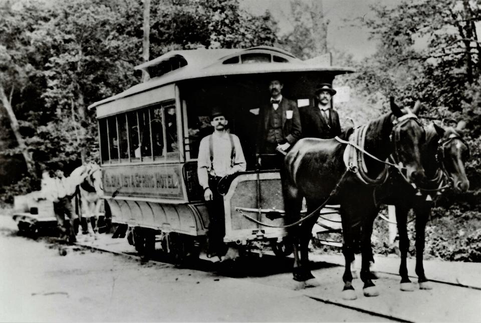 This horse-drawn trolley car is being followed by a horse-drawn baggage wagon on the way to the Buena Vista Spring railroad station on the Western Maryland Railroad during the early
1900s.