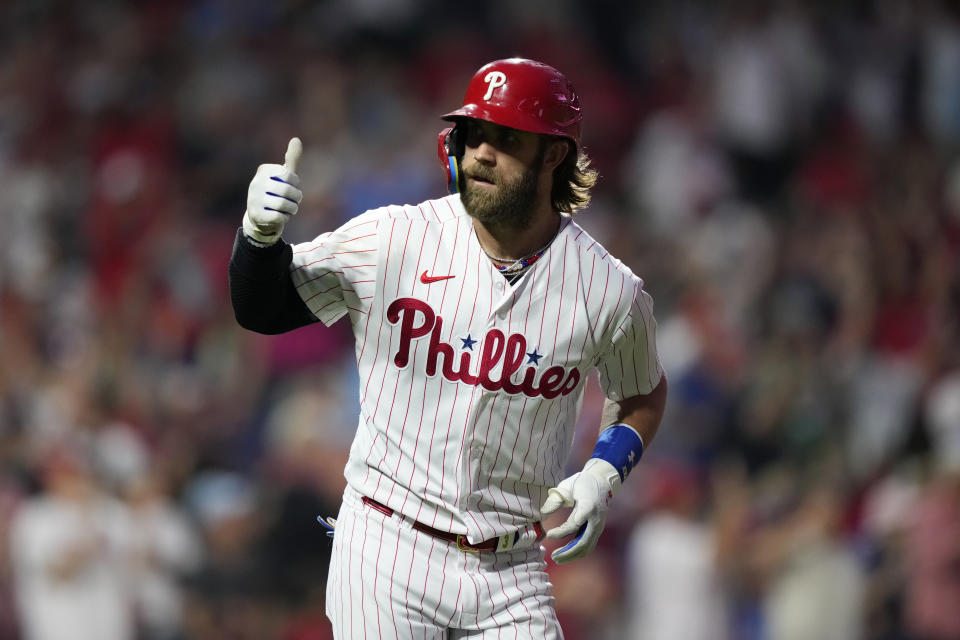 Philadelphia Phillies' Bryce Harper reacts after hitting a two-run home run against Los Angeles Angels pitcher Lucas Giolito during the fourth inning of a baseball game, Monday, Aug. 28, 2023, in Philadelphia. (AP Photo/Matt Slocum)