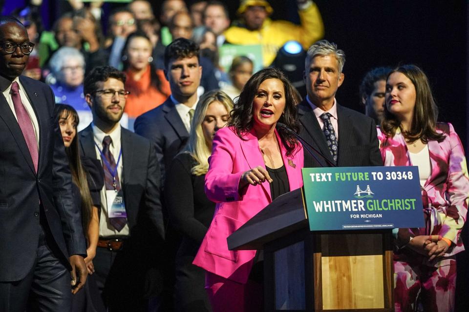 Gov. Gretchen Whitmer and Lt. Gov. Garlin Gilchrist II take the stage to speak to a crowd while celebrating her re-election during the Michigan Democratic watch party for the midterm elections at the Motor City Casino Sound Board in Detroit in the early morning on Wed., Nov. 9, 2022.