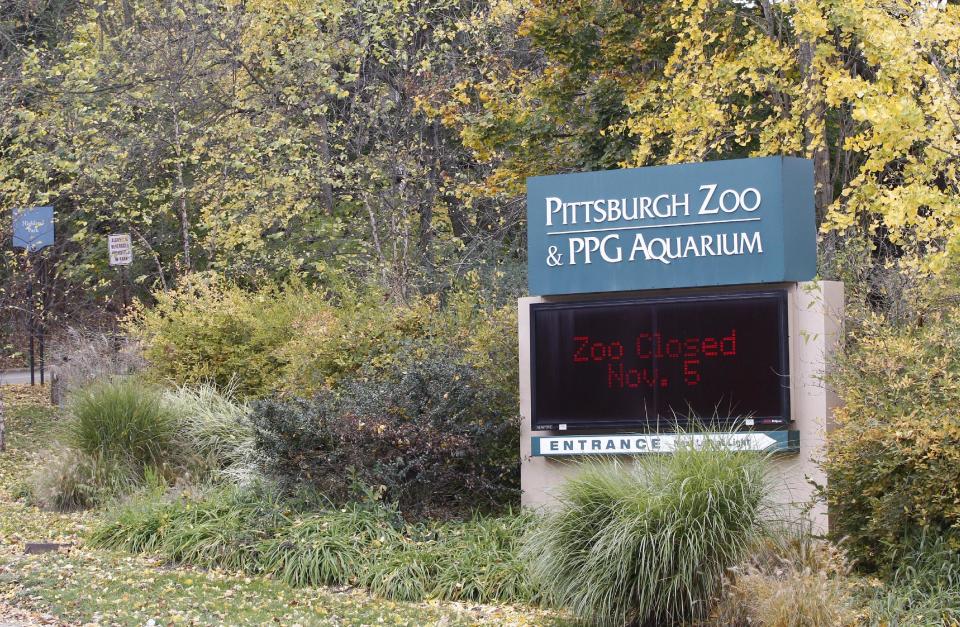 An electronic display sign near the entrance for the Pittsburgh Zoo and PPG Aquarium shows the zoo is closed on Monday, Nov. 5, 2012, in Pittsburgh. Zoo officials said a young boy was killed after he fell into the exhibit that was home to a pack of African painted dogs who pounced on the boy and mauled him on Sunday, Nov. 4, 2012. (AP Photo/Keith Srakocic)