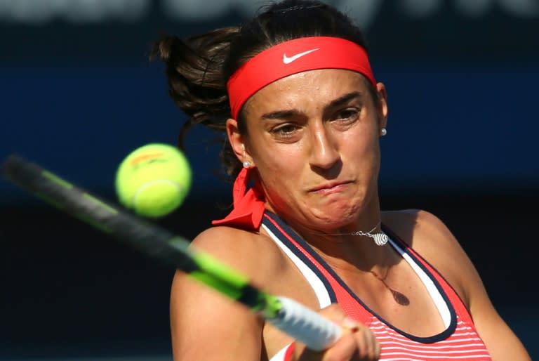 French tennis player Caroline Garcia serves the ball to German Andrea Petkovic during their quarter final WTA game of the Dubai Duty Free Tennis Championship on February 18, 2016