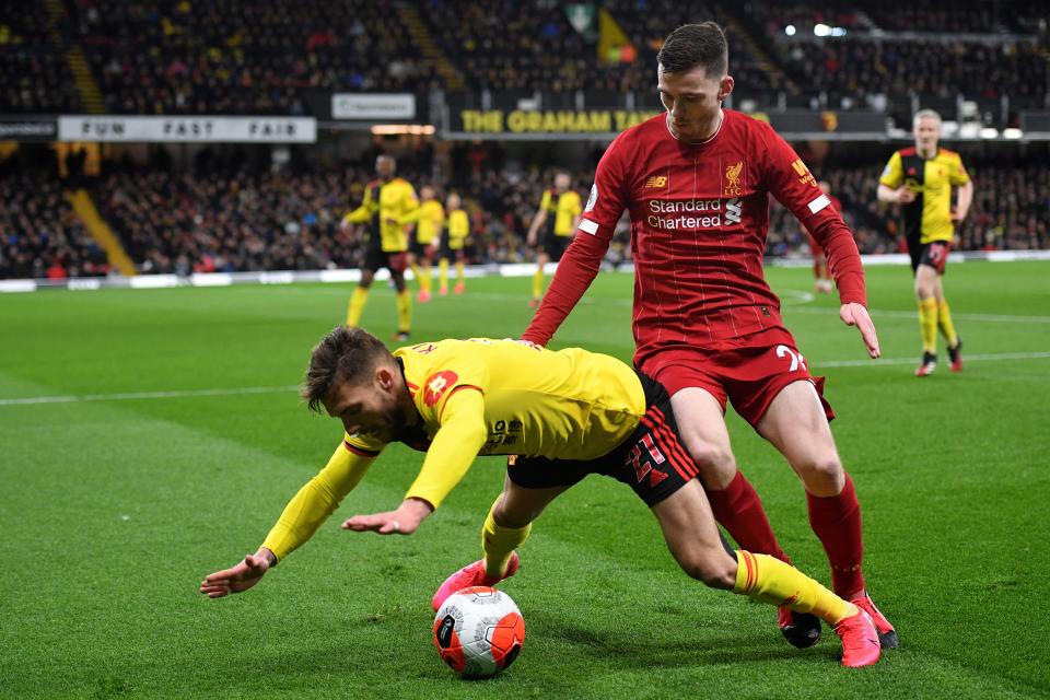 Watford's Spanish defender Kiko Femenia (L) vies with Liverpool's Scottish defender Andrew Robertson during the English Premier League football match between Watford and Liverpool at Vicarage Road Stadium in Watford, north of London on February 29, 2020. (Photo by JUSTIN TALLIS / AFP) / RESTRICTED TO EDITORIAL USE. No use with unauthorized audio, video, data, fixture lists, club/league logos or 'live' services. Online in-match use limited to 120 images. An additional 40 images may be used in extra time. No video emulation. Social media in-match use limited to 120 images. An additional 40 images may be used in extra time. No use in betting publications, games or single club/league/player publications. /  (Photo by JUSTIN TALLIS/AFP via Getty Images)