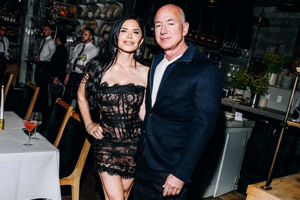 <p>Nina Westervelt/WWD via Getty Images</p> Lauren Sanchez and Jeff Bezos attend the Monse Maison Pre-Met Cocktail Celebration in New York City on May 5, 2024