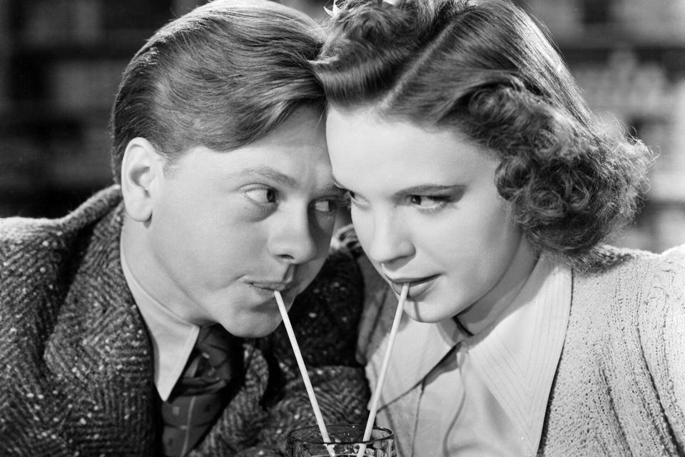 Mickey Rooney and Judy Garland sharing a soda together as they stare into one an others eyes in a scene from the film 'Babes In Arms' which was released in 1939. (Photo by Metro-Goldwyn-Metro/Getty Images)