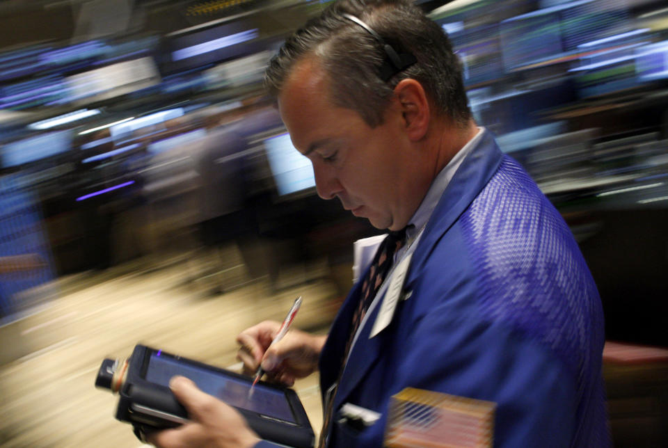 A trader works on the floor of the New York Stock Exchange August 8, 2008. REUTERS/Joshua Lott (UNITED STATES)