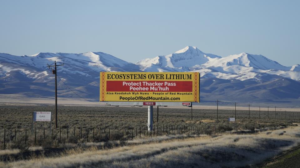 FILE - A billboard displays "Protect Thacker Pass" near the Fort McDermitt Paiute-Shoshone Indian Reservation on April 25, 2023, near McDermitt, Nev. Environmentalists, ranchers and others have fought for years against lithium mining ventures in Nevada. Yet opposition to mining one particular desert tract for the silvery white metal used in electric car batteries is coming from unusual quarters: space. (AP Photo/Rick Bowmer, File)