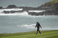 Kurt Kitayama walks down the ninth fairway of the Pebble Beach Golf Links during the second round of the AT&T Pebble Beach Pro-Am golf tournament in Pebble Beach, Calif., Friday, Feb. 3, 2023. (AP Photo/Eric Risberg)