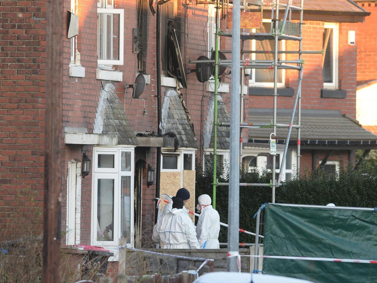 Forensic officers at the scene of the house fire Walkden, Salford: PA