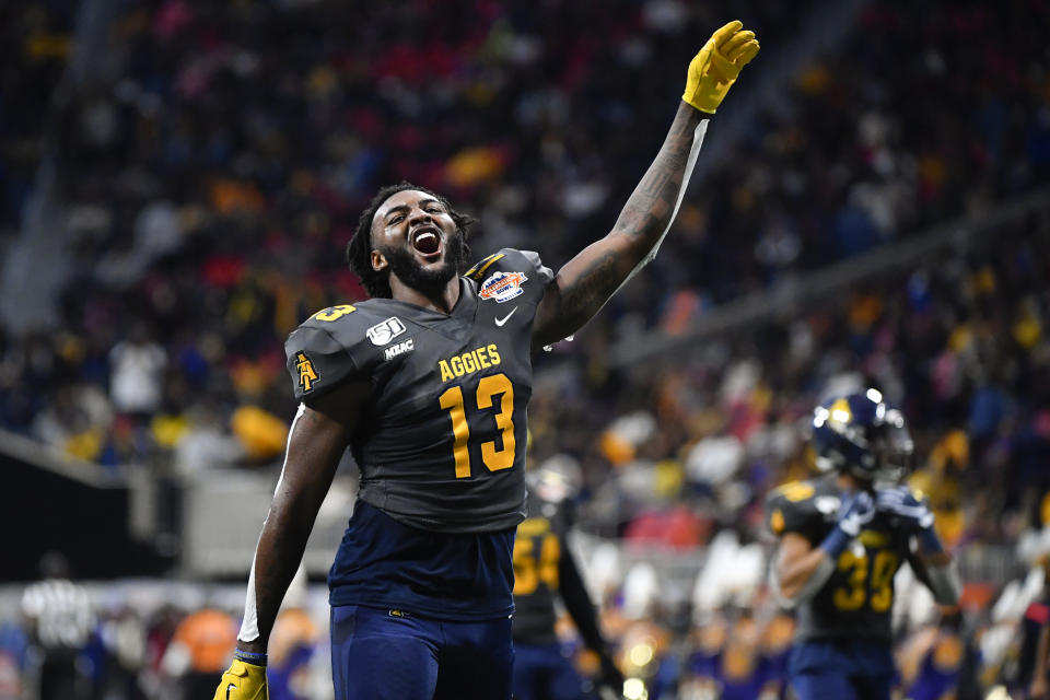 North Carolina A&T wide receiver Elijah Bell comes off the field celebrating after the first half of the Celebration Bowl NCAA college football game against Alcorn State, Saturday, Dec. 21, 2019, in Atlanta. North Carolina A&T won 64-44. (John Amis/Atlanta Journal-Constitution via AP)