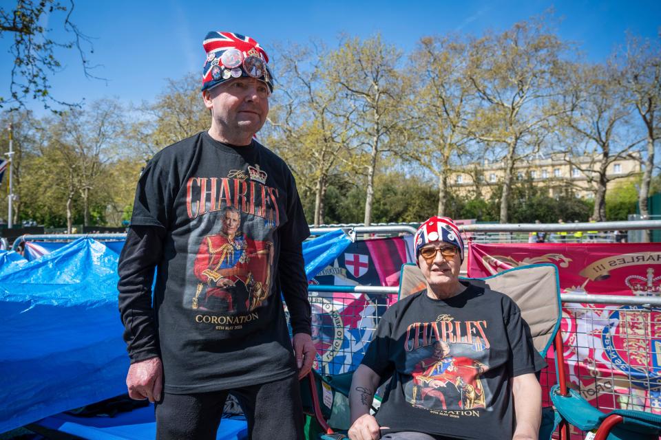 London, UK.  29 April 2023.  Royal superfans (L) John Loughrey, 68, from Streatham, and Sky London, 62, from Paddington, in place on The Mall ahead of the coronation of King Charles III on 6 May.  They will be camping out for the next week, sleeping on campbeds, joined by up to 10 others, with a giant sheet of blue tarpaulin as their protection against the elements until the big day. . Credit: Stephen Chung / Alamy Live News