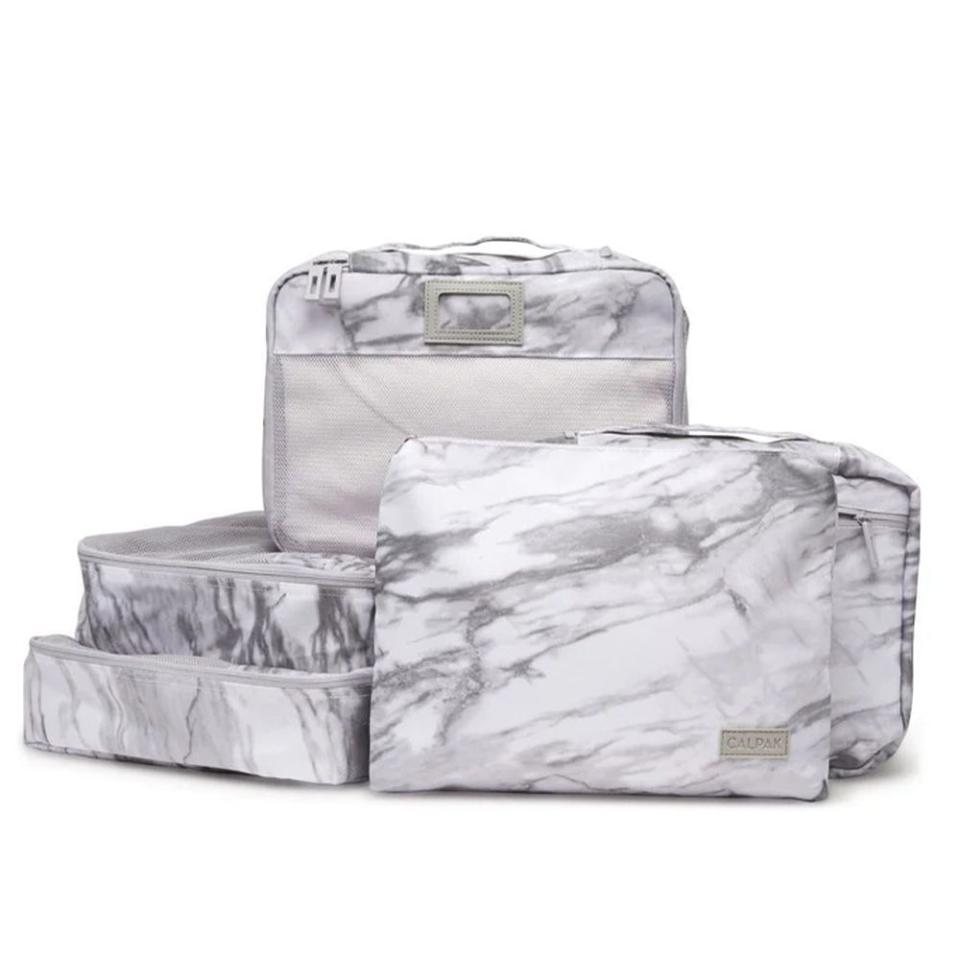 <p><a href="https://go.redirectingat.com?id=74968X1596630&url=https%3A%2F%2Fwww.calpaktravel.com%2Fproducts%2Fpacking-cubes-5-piece-set&sref=https%3A%2F%2F" rel="nofollow noopener" target="_blank" data-ylk="slk:Shop Now;elm:context_link;itc:0;sec:content-canvas" class="link ">Shop Now</a></p><p>Packing Cubes Set (5 Pieces)</p><p>calpaktravel.com</p><p>$54.40</p>