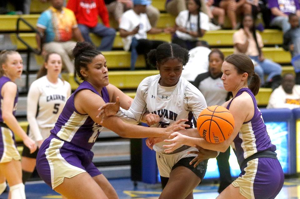 Calvary's Damaris Shields has the ball stripped away as she attempts to break a Lumpkin County double team during the 3A semifinals on Friday March 3, 2023 at Fort Valley State University.