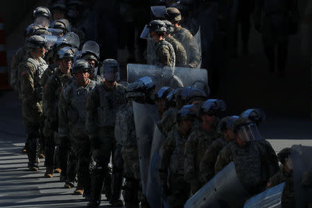 FILE PHOTO: U.S. Military troops return from a test deployment with U.S. Customs and Border Protection agents after conducting a large-scale operational readiness exercise at the San Ysidro port of entry with Mexico in San Diego, California, U.S., Jan. 10, 2019. REUTERS/Mike Blake/File Photo