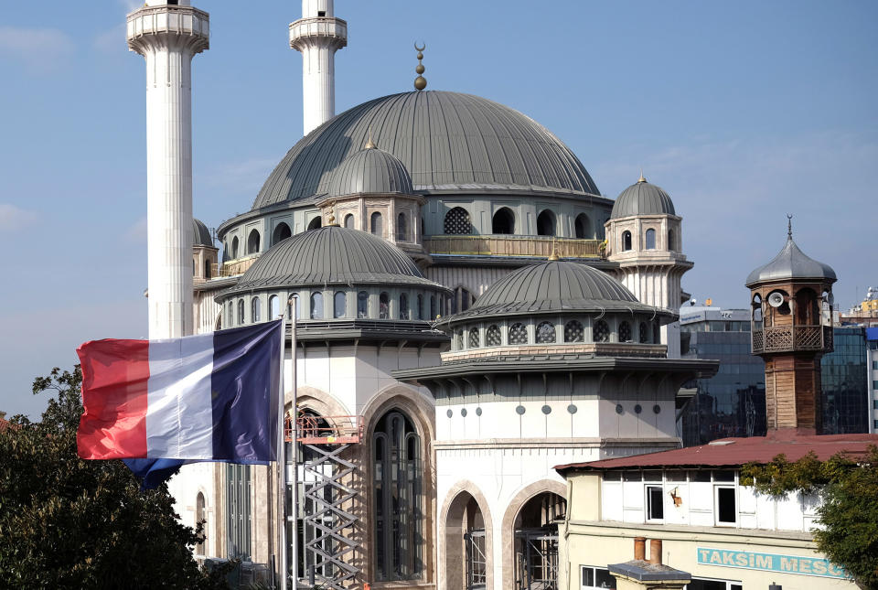 Image: A French flag flutters above the French Consulate, with a new mosque under construction in the background, in central Istanbul, (Murad Sezer / Reuters)