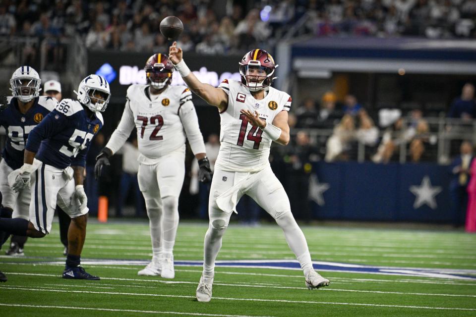 Washington Commanders quarterback Sam Howell (14) passes against the Dallas Cowboys during the second quarter at AT&T Stadium. Mandatory Credit: Jerome Miron-USA TODAY Sports