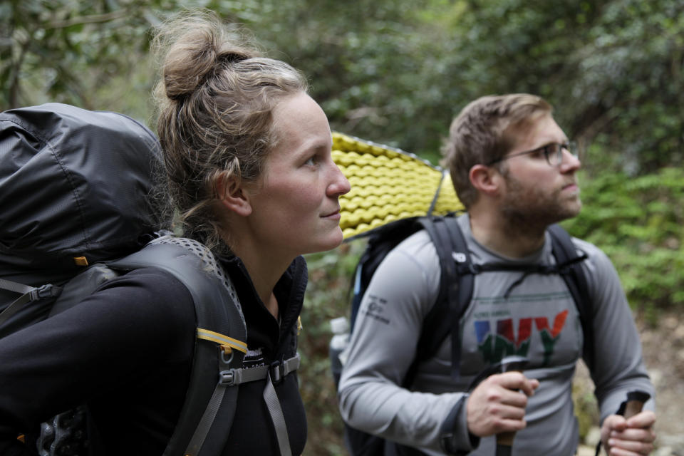 In this March 30, 2020, photo, Alexandra Eagle, left, and Jonathan Hall soak up their last moments hiking the Appalachian Trail in Cosby, Tenn. The couple is postponing the 2,190-mile hike until the coronavirus pandemic ends. (AP Photo/Sarah Blake Morgan)