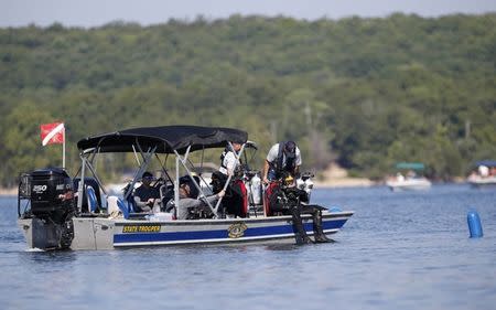 July 23, 2018; Branson, MO, USA; Divers from the Missouri State Highway Patrol enter the water at Table Rock Lake on Monday, July 23, 2018 to begin salvage operations of a duck boat that sank, killing 17 people last week. Mandatory Credit: Nathan Papes/News-Leader via USA TODAY NETWORK