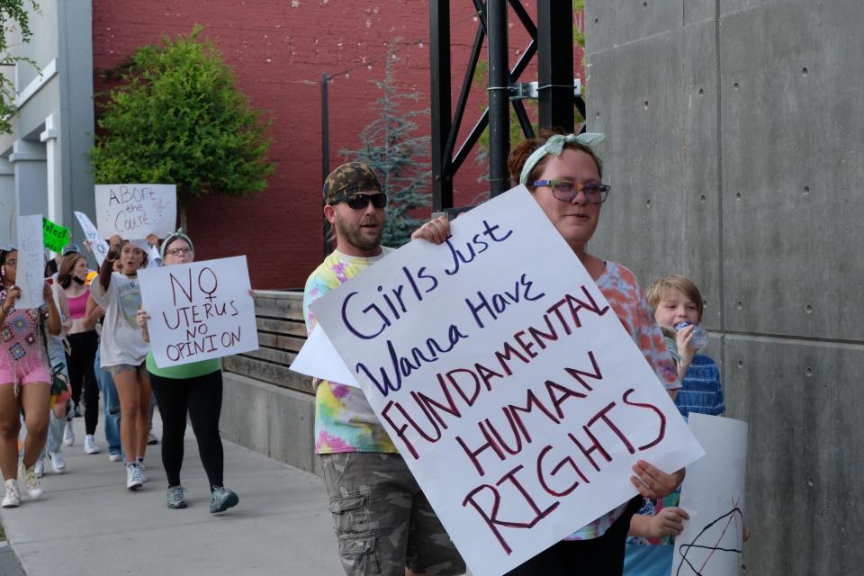 Pro-choice demonstrators gathered Thursday evening to protest outside and around Rep. Ronny Jackson's downtown Amarillo office to show their displeasure with the overturning of Roe vs. Wade by the Supreme Court.