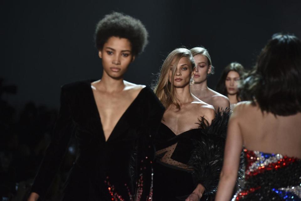 Models wear creations by Alexandre Vauthier during his Haute Couture Spring-Summer 2017 fashion collection presented in Paris, Tuesday, Jan. 24, 2017. (AP Photo/Zacharie Scheurer)