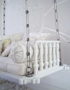 The sitting room feaures a (you guessed it) white hanging sofa. Careful, don't chip that white paint on the backswing. <i>(Photo: Goop.com)</i>