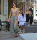 <p>Forget about he cornrows—it’s Kendall’s printed two-piece we’re talking about! The 19-year-old stepped out for some retail therapy with the Kardashian clan in a black and white snakeskin Zimmerman ensemble. She wore a bikini top with a matching wrap-around maxi skirt with a thigh-high slit, aviator sunglasses, and gladiator sandals.</p>