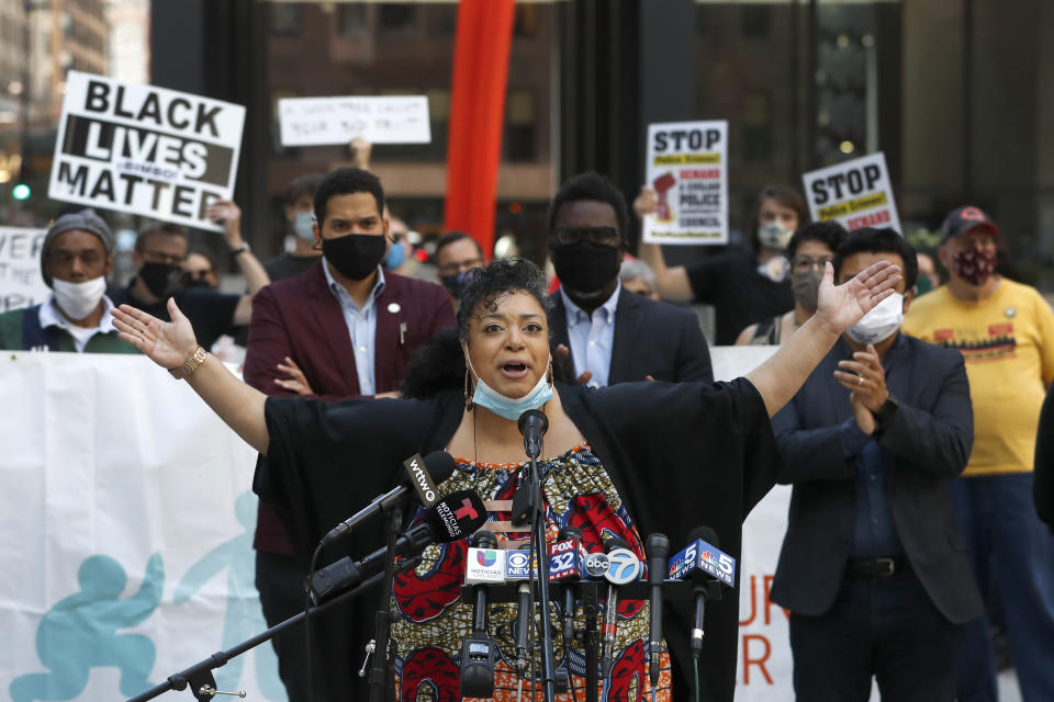 Aislinn Pulley, a founding member of Black Lives Matter in Chicago, speaks at a rally on Federal Plaza Thursday, July 23, 2020, after a collection of Chicago activists groups announced they are filing a federal lawsuit against the Chicago Police Department, Fraternal Order of Police, and the federal government, in Chicago. The lawsuit also asks a judge to prevent agents in Chicago from making arrests or detaining people without probable cause and to require agents to identify themselves and their agency before taking either action and explain why someone is being arrested. (AP Photo/Charles Rex Arbogast)